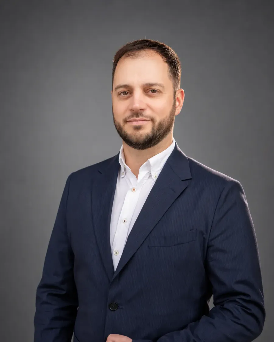 Corporate headshot of a man in a navy suit in Cambridge by Immortal Photography